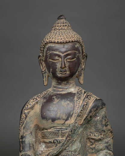 Close-up of handcrafted copper Shakyamuni Buddha statue with detailed antique finish