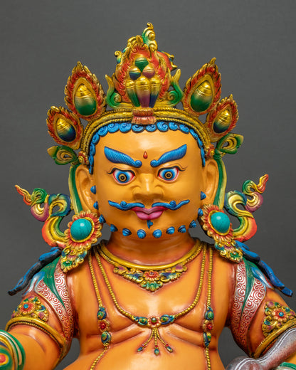 Close Up of Handcrafted Yellow Dzambhala Statue with Gold Gilded Crown and Turquoise Stones