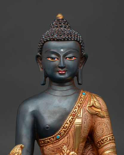 Close Up of Healing Medicine Buddha Statue with Serene Face and Gold Plated Healing Bowl