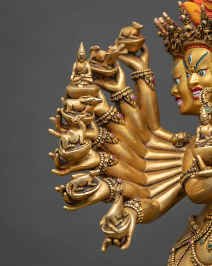 Close-up of Hevajra’s left hands holding skull cups with animals, symbolizing mastery over samsara