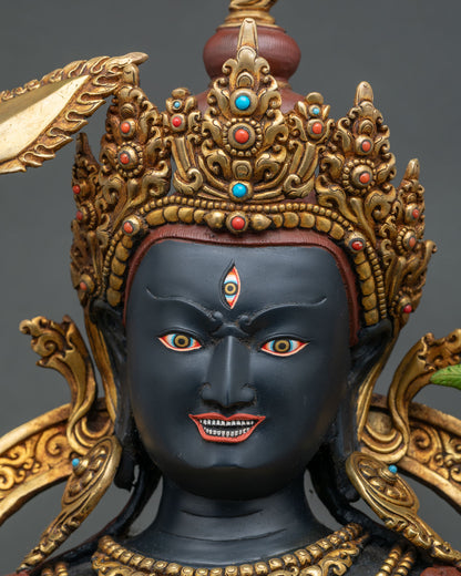 Close-up of Jampal Nagpo statue face with wrathful expression, third eye and hand-painted details