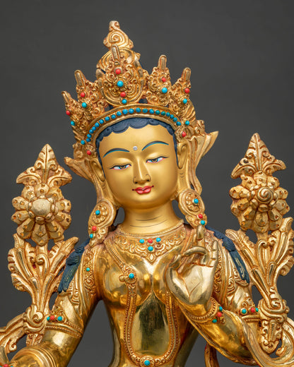 Close up of Jetsun Drolma Green Tara statue with five-jeweled crown and 24K gold fire gilding