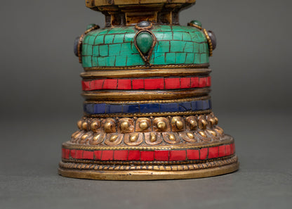 Close-up of Kadampa Stupa featuring turquoise, coral-red, and lapis lazuli gemstone inlays
