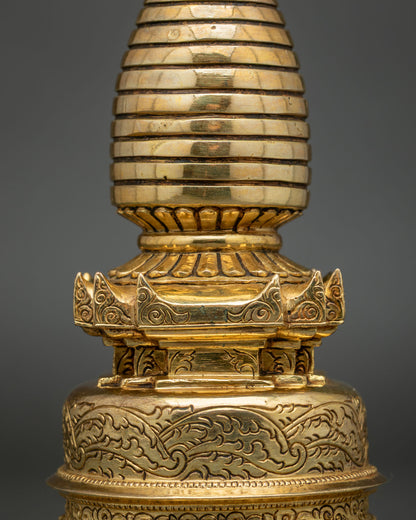 Close-up of Kadampa Stupa with intricate floral motifs and 24K gold plating