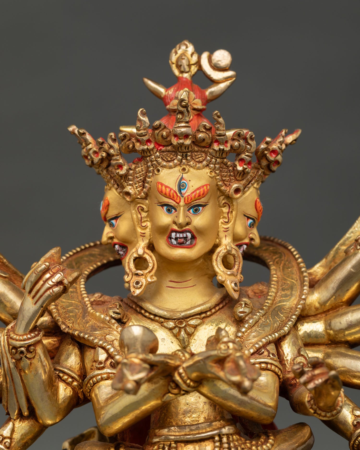 close up of kalachakra buddhist statue showing intricate gold gilded detailsa