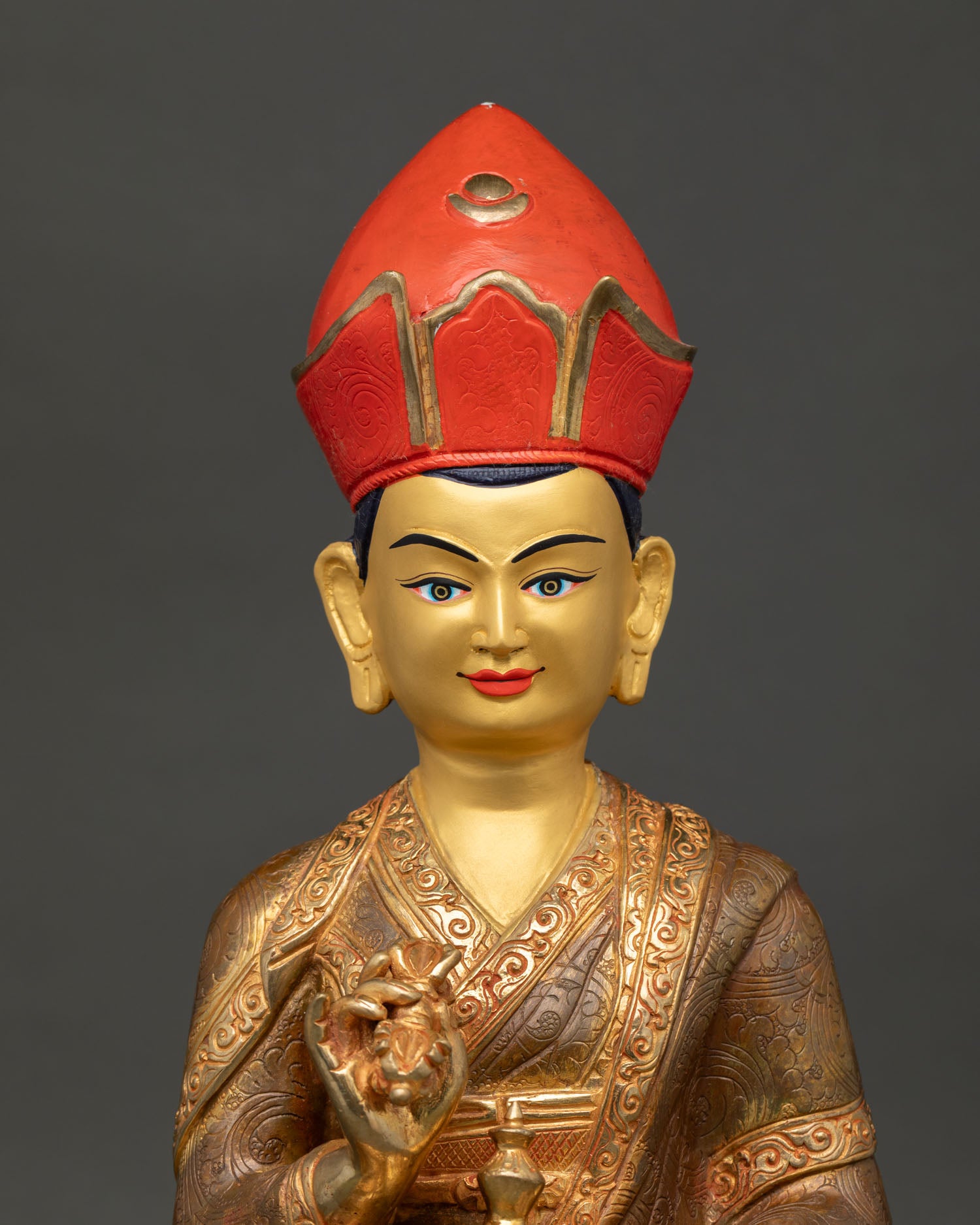 Close up of Karmapa Statue, showing serene face acrylic details and Himalayan craftsmanship