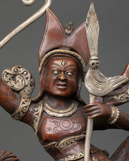 close-up of king gesar statue showing armor details and silver plated craftsmanship
