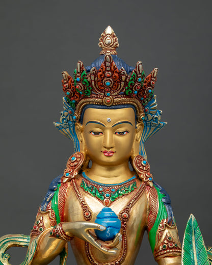 Close up of Kshitigarbha Buddhist statue showing hand painted details and sacred ornaments