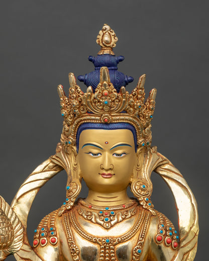 Close-up of Kshitigarbha hands holding sacred Cintamani jewel and semi-precious stones
