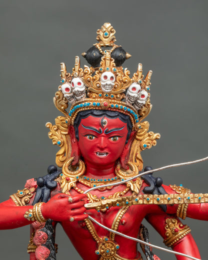 Close-up of Kurukulla statue face with third eye and skull crown, hand-painted copper Red Tara sculpture