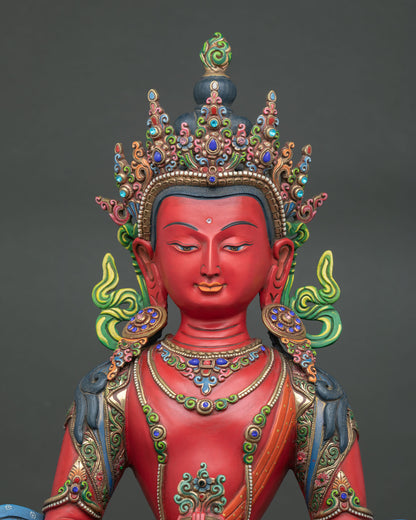 close up of large amitayus statue with ornate crown, hand painted and gold gilded in nepal