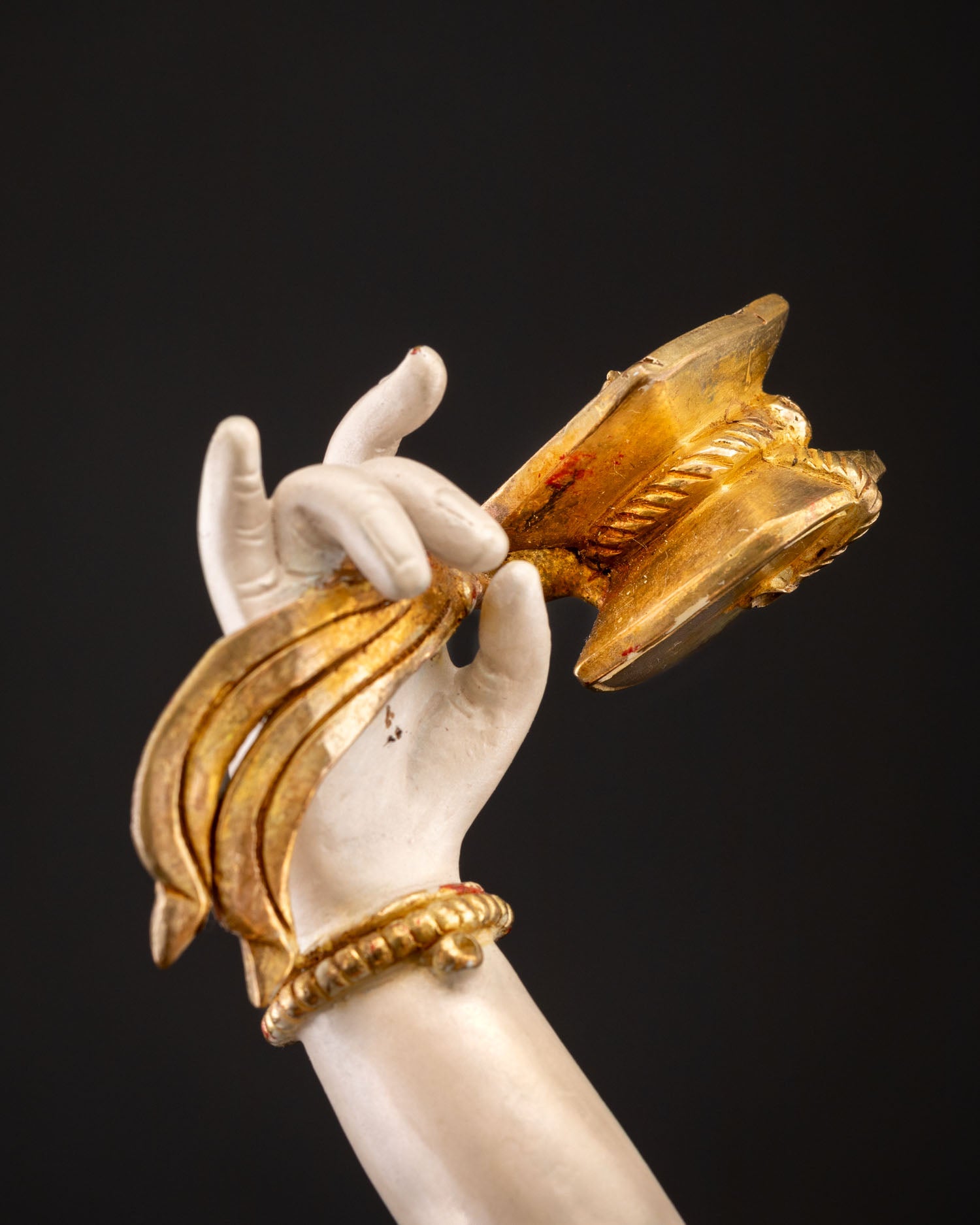 Close-up of Machig Labdron Statue holding ritual damaru drum in raised hand