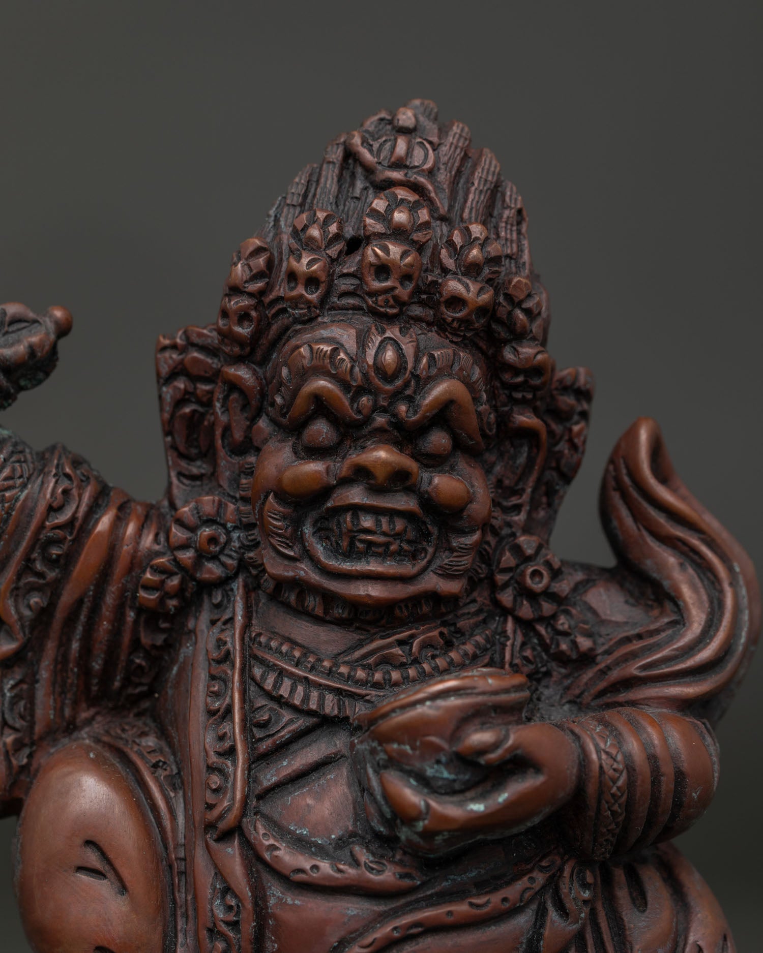 Close Up of Mahakala Bernagchen Wrathful Face with Skull Garland and Flame Halo.