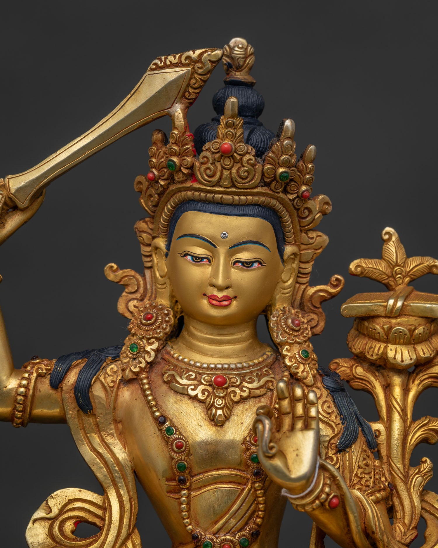 Close Up of Manjushri Gold Painted Face and Five Jewel Crown.