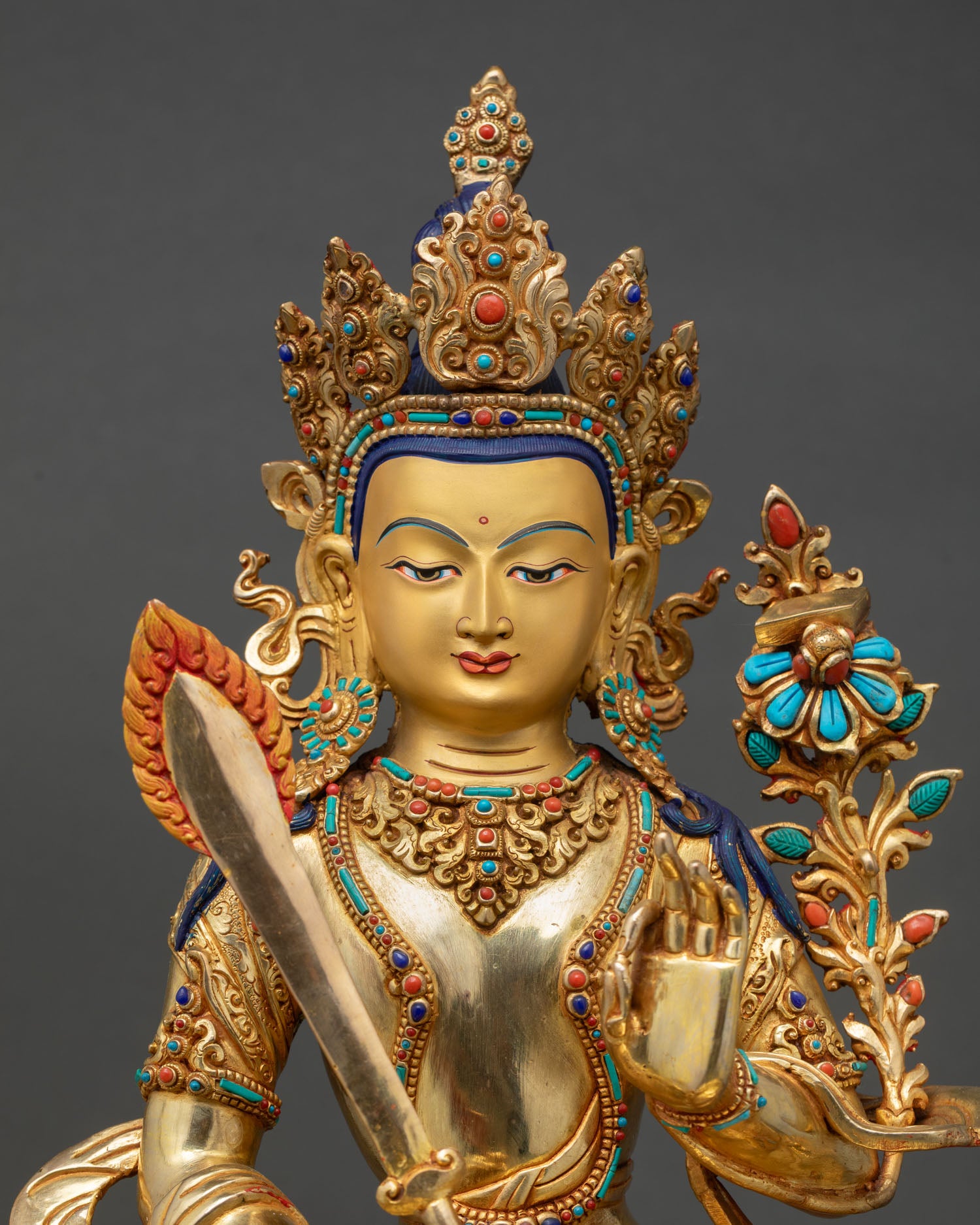 Close Up Of Manjushri Statue With Intricate Filigree And Semi Precious Stones