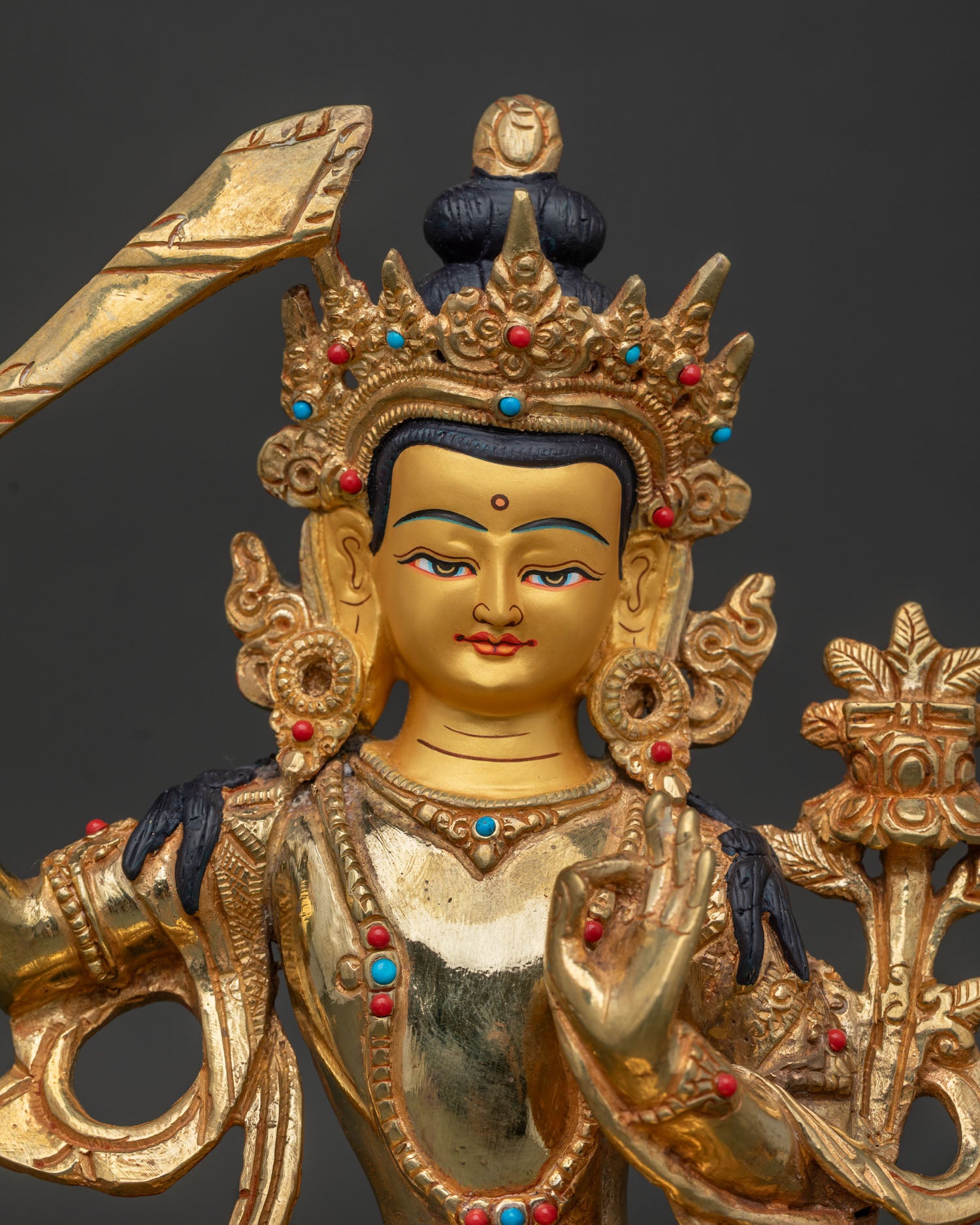 Close Up of Manjushri Statue with Intricate Gold Gilded Details