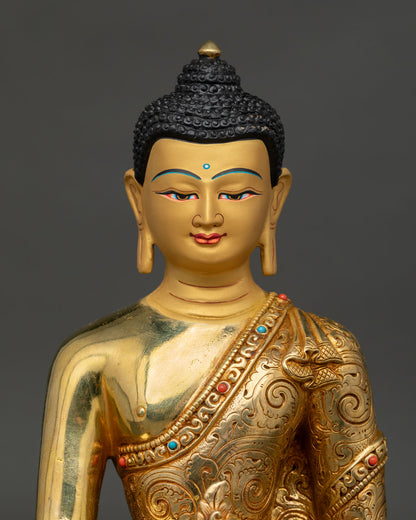 Close up of Medicine Buddha sculpture highlighting the intricately carved floral motif robe