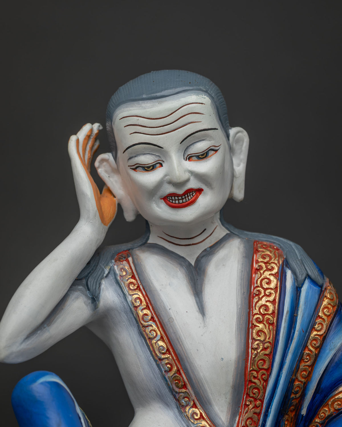 Close up of Milarepa statue holding a skull cup, handcrafted in Nepal from copper