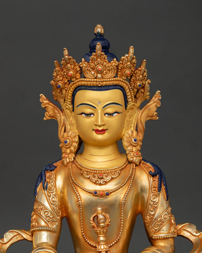 close up of mitrugpa buddha serene face gold painted details and semi precious stone inlays