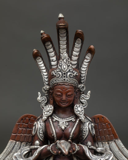 Close up of Naga Kanya statue with serene face oxidized copper finish and sacred cobra canopy