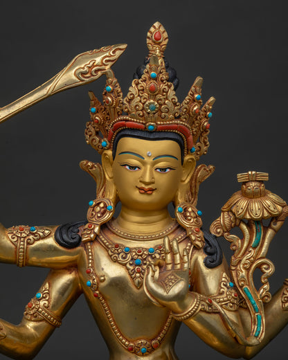 Close up of Namasangiti Maha Manjushri Statue with gold gilding and gemstone details