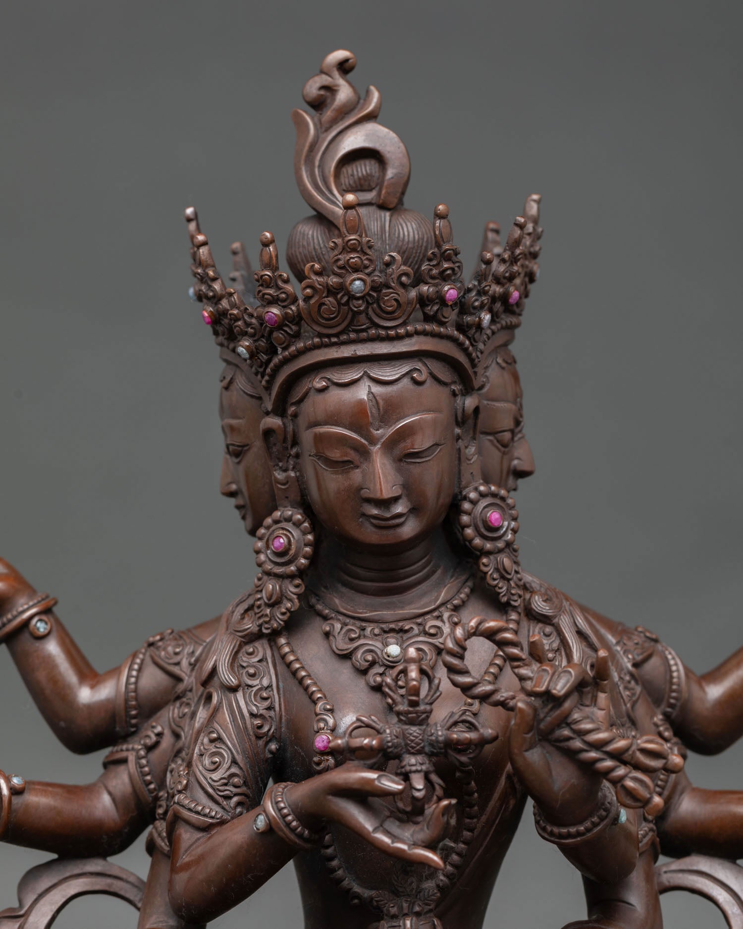 Close up of Namgyalma three faces statue representing wisdom compassion and awareness Himalayan sculpture
