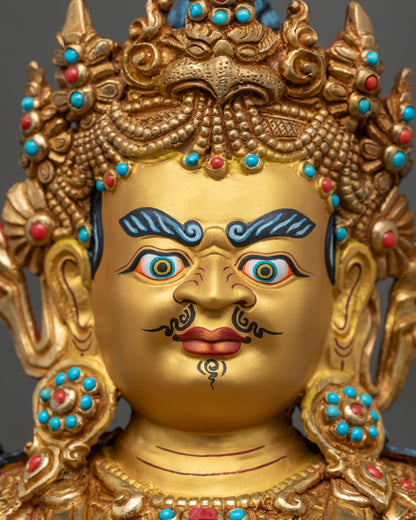 Close-up of Namtoshe statue face with hand-painted eyes, kirtimukha crown and turquoise inlay