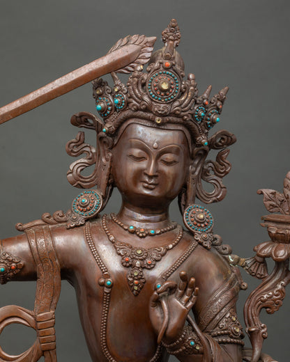 Close-up of Oxidized Copper Manjushri Statue – Handcrafted Wisdom Bodhisattva Detail