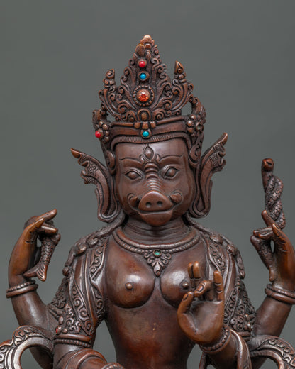 close up of oxidized four armed varahi statue with intricate copper craftsmanship