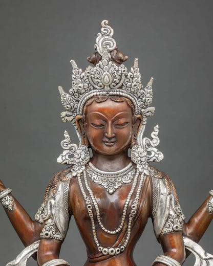 Close up of Prajnaparamita statue’s silver-plated crown, necklaces and oxidized copper torso