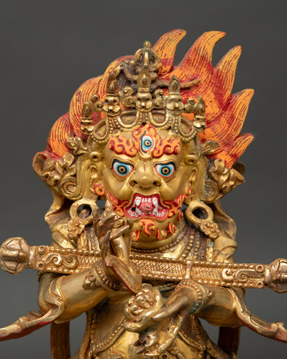 Close up of Sakya Mahakala wrathful face with gold painted details and intricate Himalayan craftsmanship