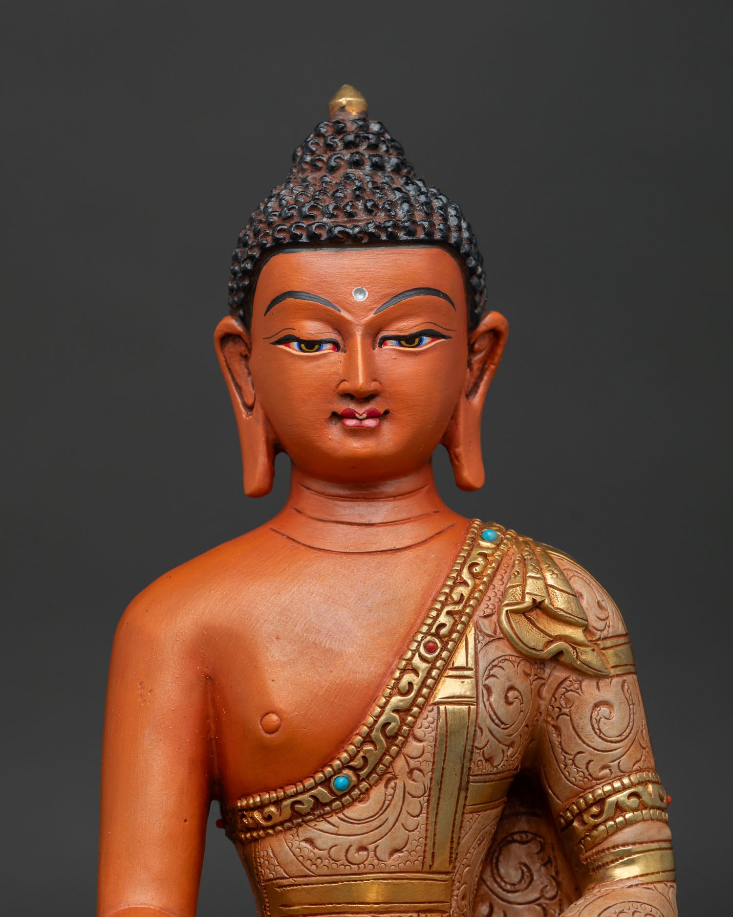Close Up of Shakyamuni Buddha Face with Hand Painted Acrylic Finish and Serene Expression