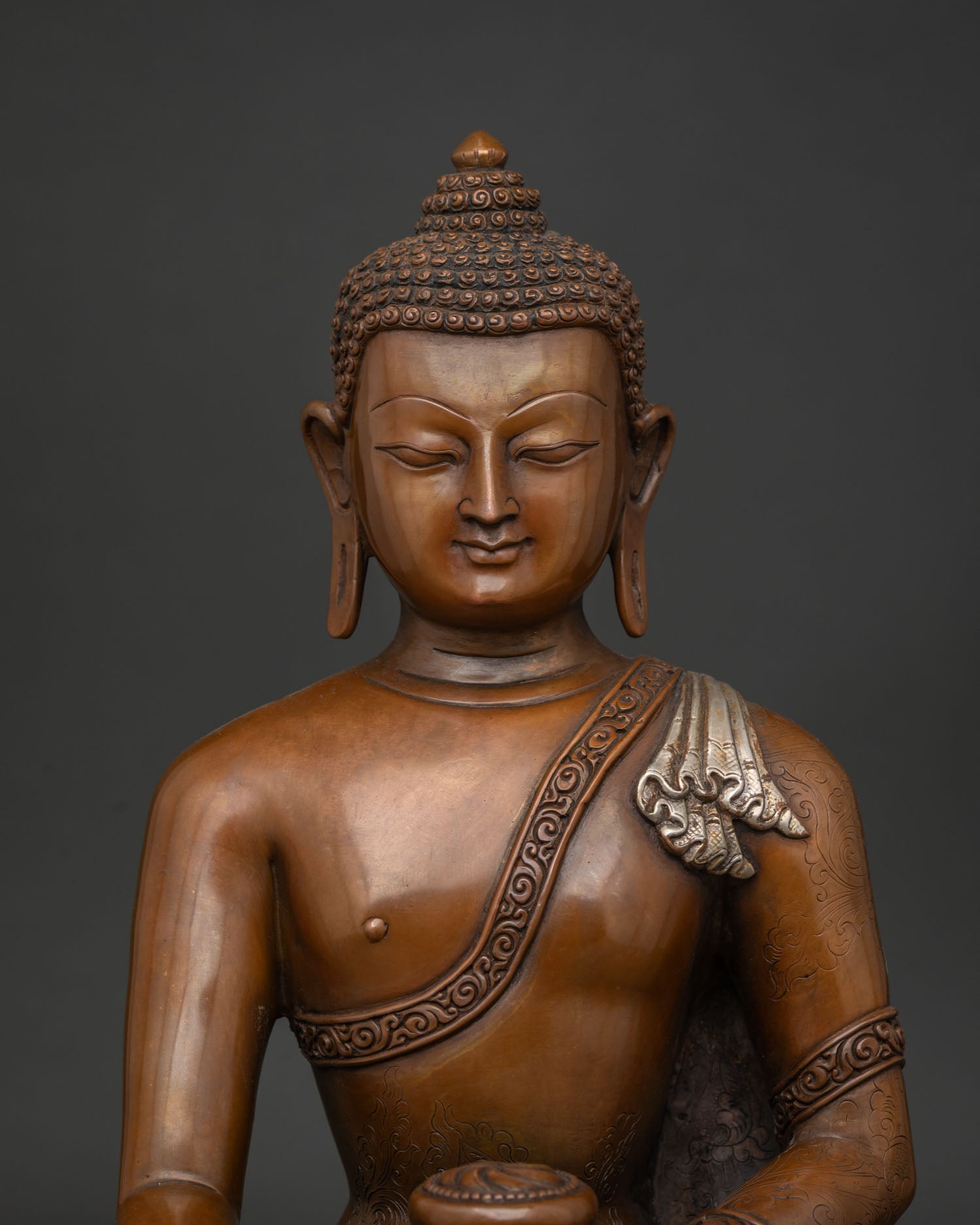 Close Up of Shakyamuni Buddha Face with Oxidized Silver Plated Finish.