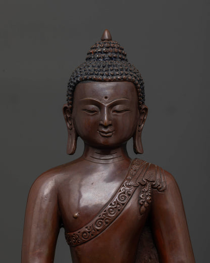 Close up of Shakyamuni Buddha showing peaceful face and detailed Buddhist sculpture