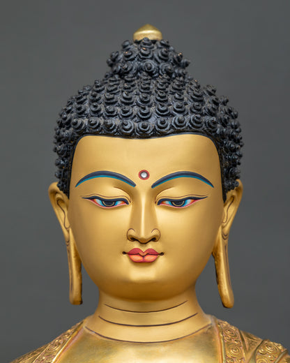 Close-up of Shakyamuni Buddha statue face with hand-painted eyes, curled hair and serene expression