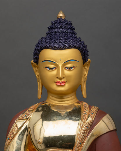 close up of Shakyamuni Buddha statue showing gold gilded details and craftsmanship