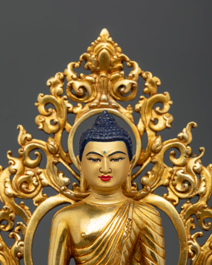 Close Up of Shakyamuni Buddha Statue with Gold Painted Face and Intricate Details