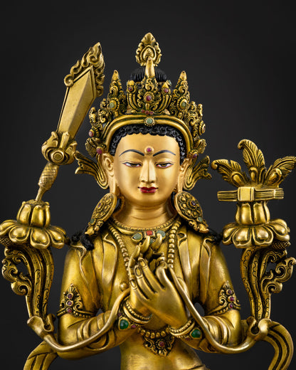 Close-up of Simhanada Manjushri statue with gold fire-gilded details