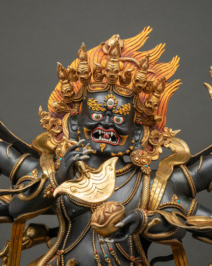 Close up of Six-Armed Black Mahakala Statue with gold gilding and turquoise coral inlay, Nepal