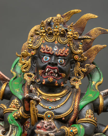 Close up of Six Armed Mahakala fierce face third eye fangs skull crown Buddhist protector