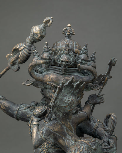 Close-up of skull diadem on Yamantaka’s buffalo head, handcrafted Himalayan bronze sculpture