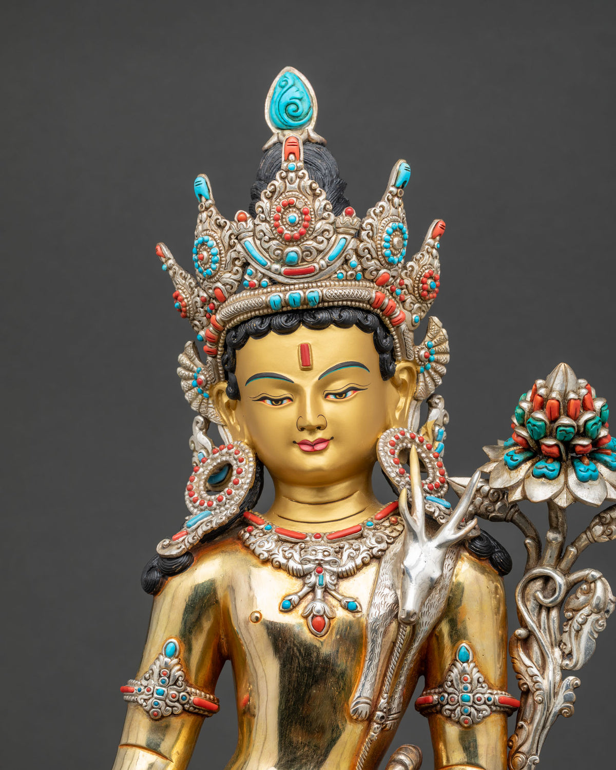 Close-up of Standing Lokeshvara statue showing gold gilding and silver detailing