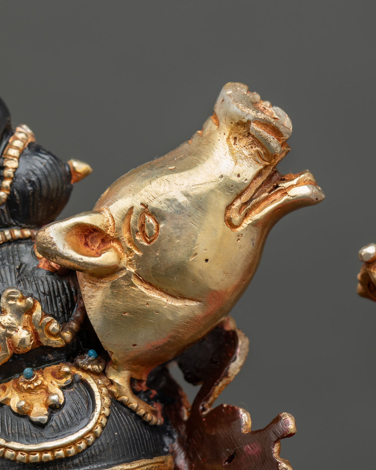 Close-up of the golden sow’s head on the Dorje Phagmo statue, the sacred emblem of Vajravarahi
