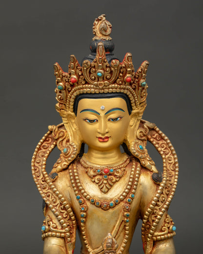 Close up of the Mitrugpa Buddha Statue highlighting the gold painted face and intricate Newari craftsmanship. 