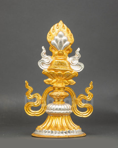 Close up of Tibetan King and Queen ceremonial symbols with gold gilding and silver plating