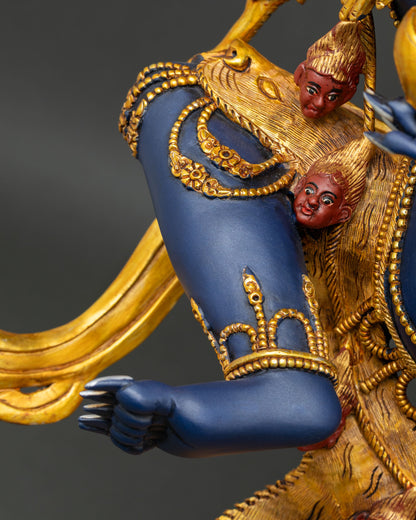 Close-up of Troma Nagmo Statue's arm with gold-gilded ornaments and intricate craftsmanship.