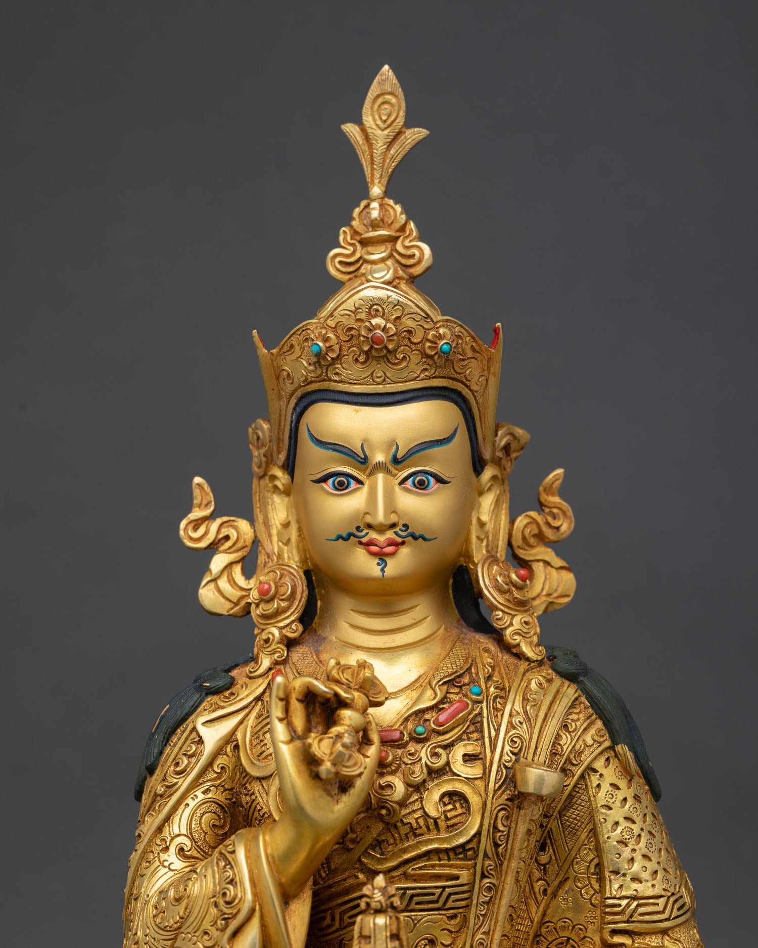 close up of tsokye dorje statue with 24k gold gilded sacred details