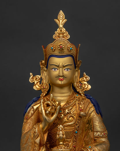 Close up of Tsokye Dorje Statue with gold painted face and semi precious stones