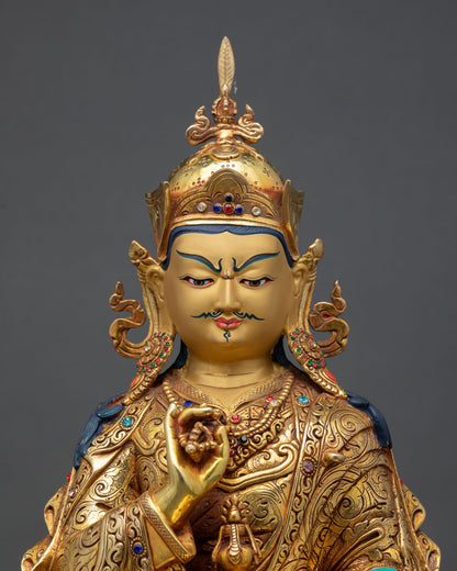 close up of tsokye dorje statue with repoussé details and turquoise coral inlays