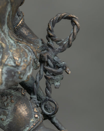 Close-up of twisted rope detail on Yamantaka Vajrabhairava bronze statue, Nepal craftsmanship